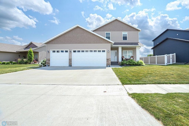 view of front of home featuring a garage and a front yard