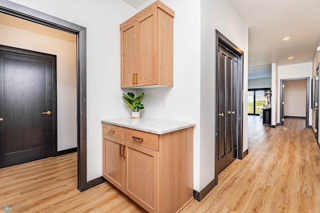 hall featuring light hardwood / wood-style flooring