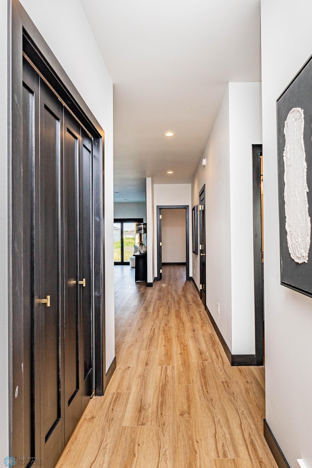 corridor featuring light wood-type flooring