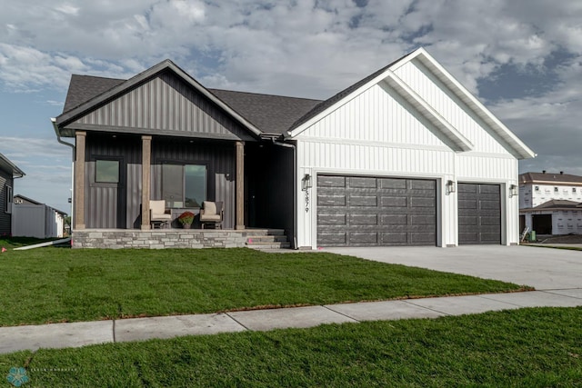 modern inspired farmhouse with a garage and a front yard