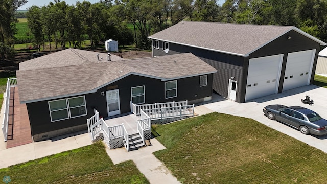 view of front of property with a garage and a front yard