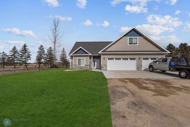 view of front of property featuring a garage and a front lawn