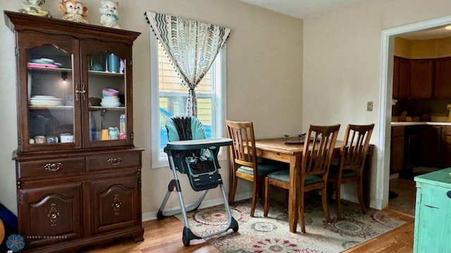 dining area with light hardwood / wood-style flooring