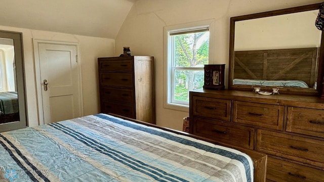 bedroom featuring lofted ceiling