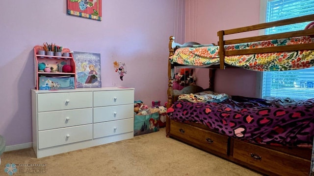 bedroom featuring light carpet