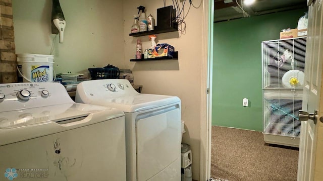 washroom featuring washer and clothes dryer and carpet floors