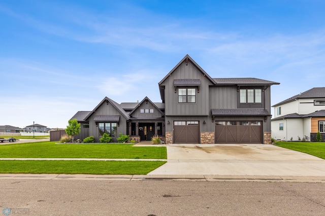 view of front of home with a garage and a front yard