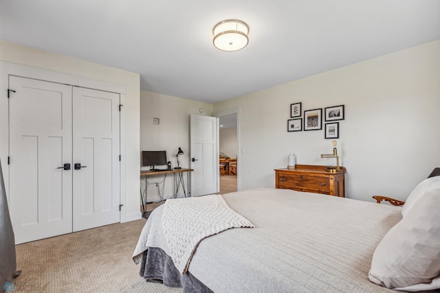 bedroom with light carpet and a closet