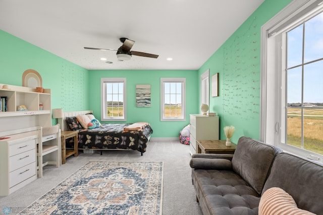 carpeted bedroom featuring ceiling fan