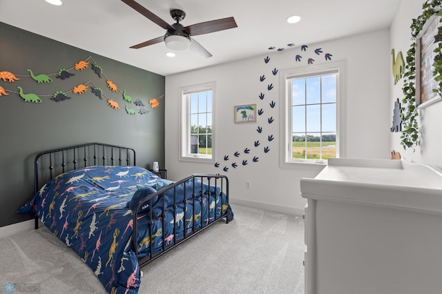 carpeted bedroom featuring ceiling fan