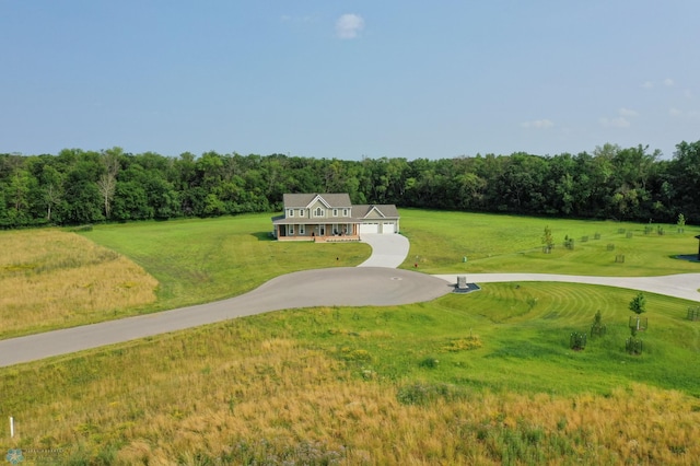 view of home's community with a yard