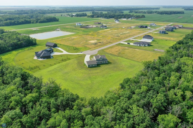 birds eye view of property with a rural view