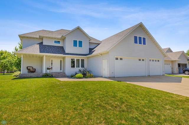 view of front facade featuring a garage and a front lawn