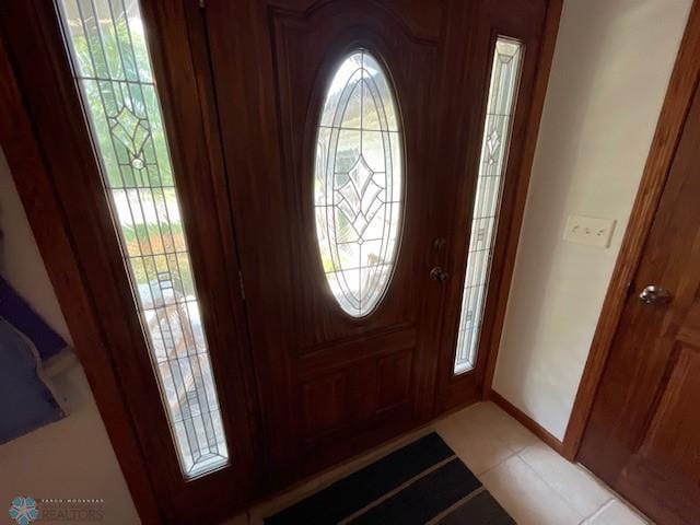 entryway featuring light tile patterned floors