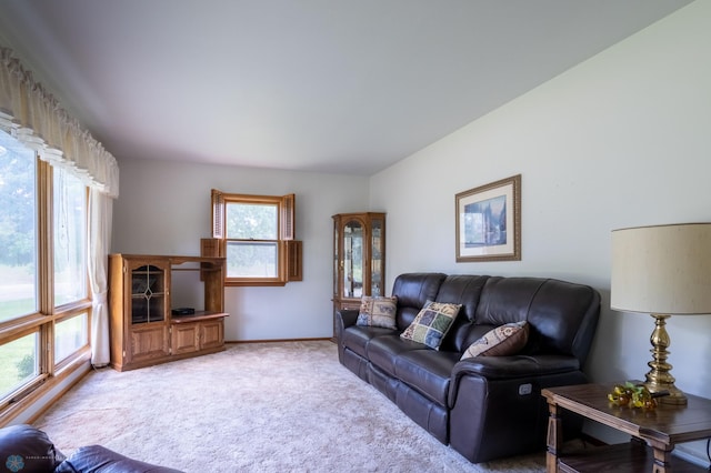 living room with plenty of natural light and light carpet