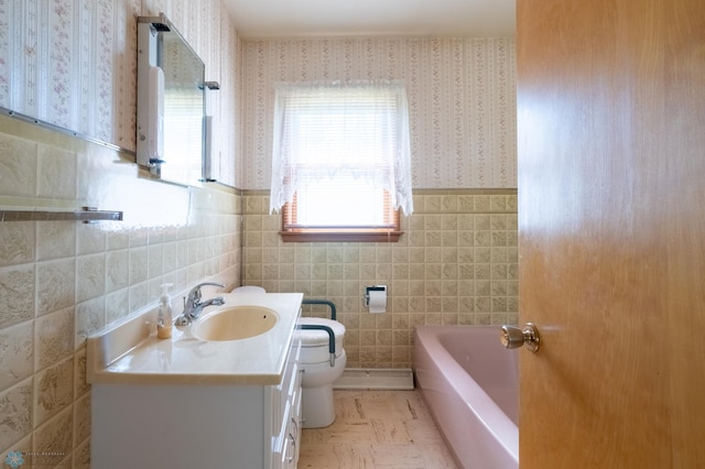 bathroom featuring tile walls, toilet, and vanity