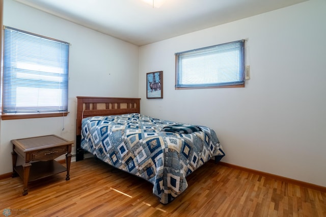 bedroom with light hardwood / wood-style floors