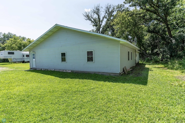 view of property exterior with a yard