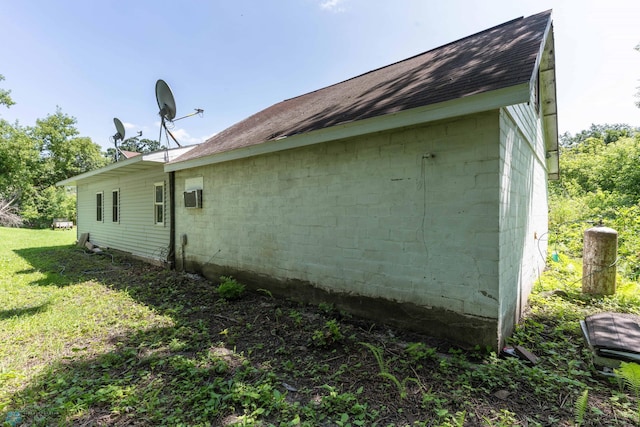 view of property exterior with a lawn