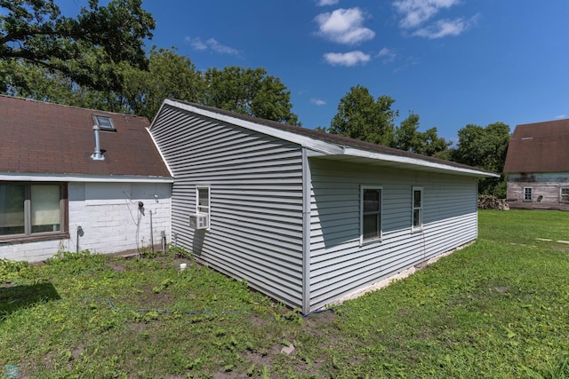 view of home's exterior with a yard