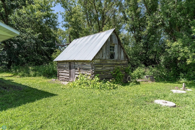 view of outdoor structure with a lawn