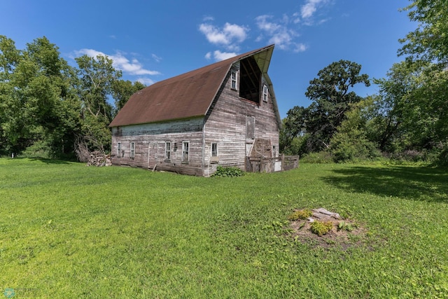 view of home's exterior with a yard