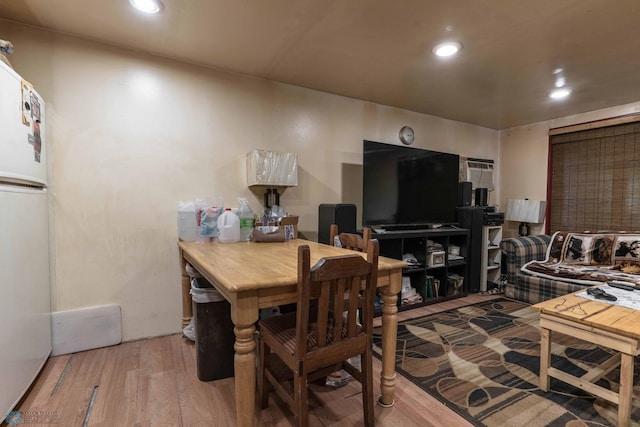 dining space with light wood-type flooring