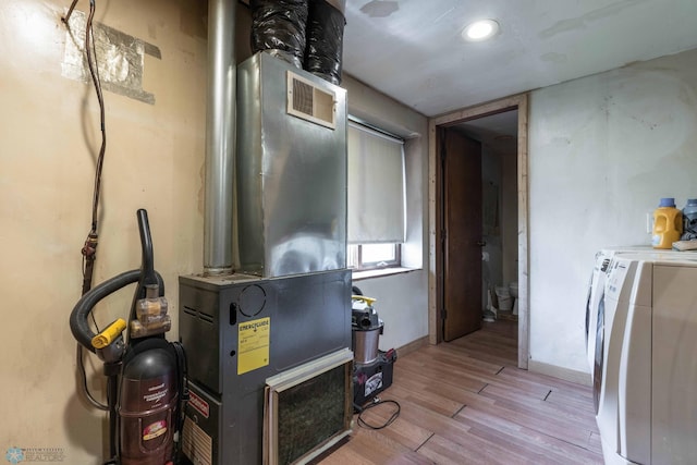 utility room with separate washer and dryer