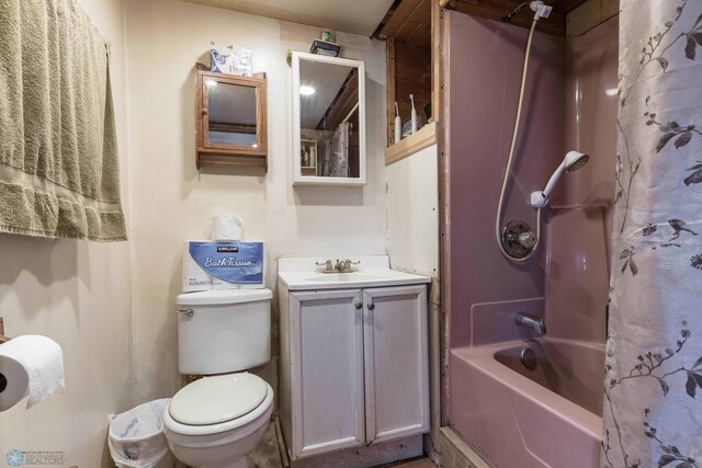 full bathroom featuring vanity, toilet, and shower / bath combination with curtain