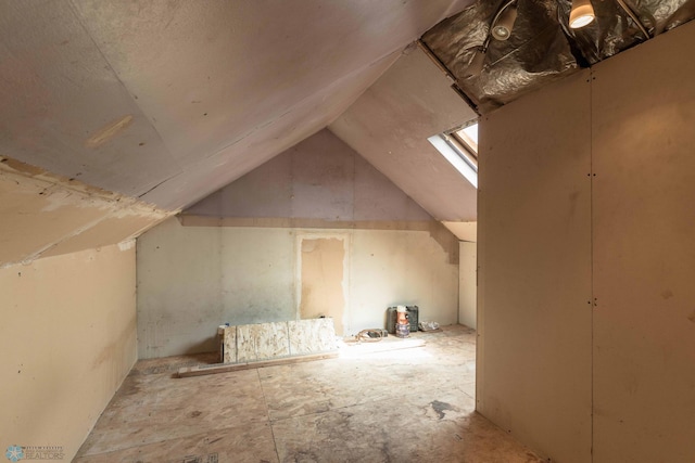 additional living space featuring vaulted ceiling