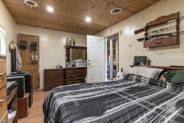 bedroom with light wood-type flooring and wood ceiling