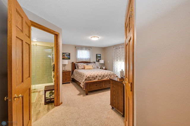 bedroom with light colored carpet