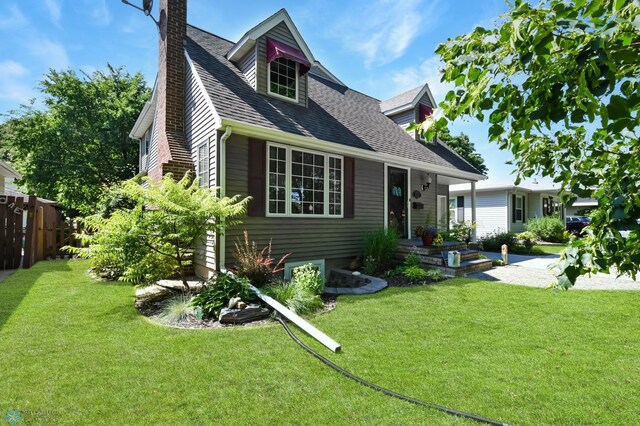 rear view of house with a lawn