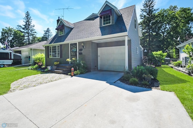 cape cod home with a garage and a front yard