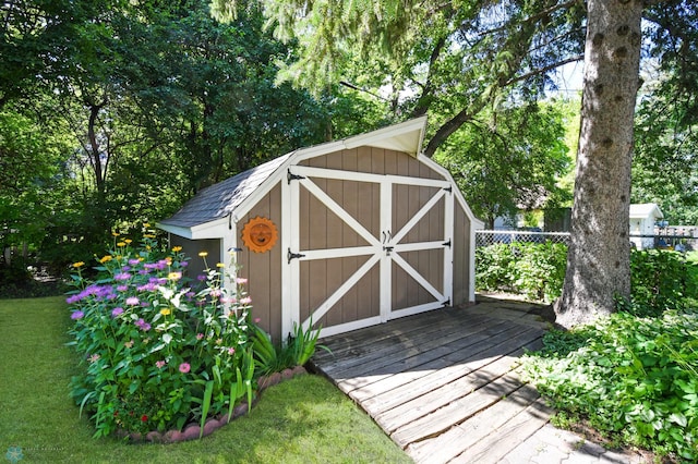 view of outdoor structure featuring a lawn