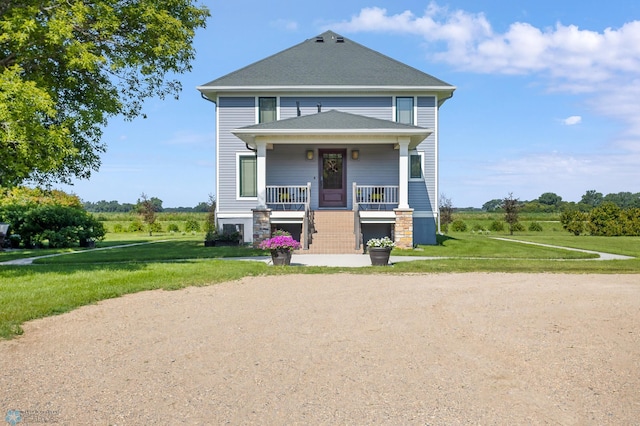 view of front facade with a porch and a front lawn