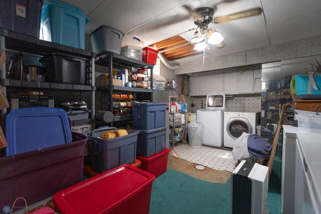 basement with washing machine and dryer and ceiling fan