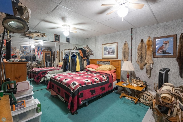 bedroom with a drop ceiling and ceiling fan