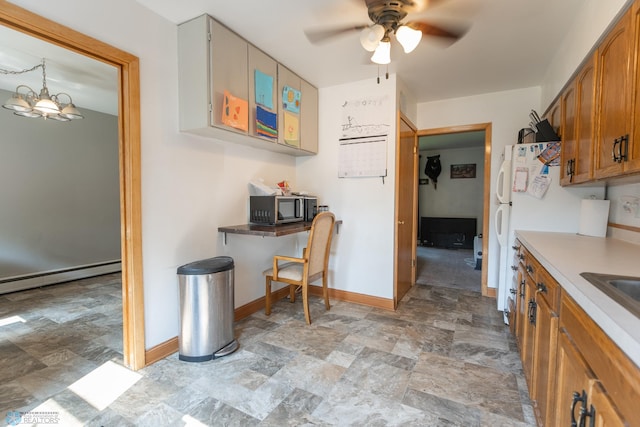 kitchen featuring light tile patterned flooring, ceiling fan with notable chandelier, and a baseboard heating unit