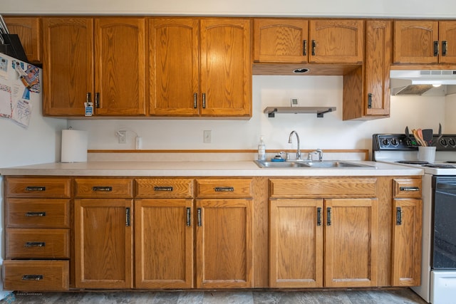 kitchen with sink, white electric range oven, and wall chimney exhaust hood