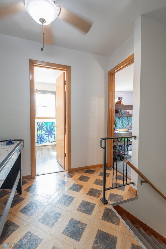 hall with light tile patterned floors