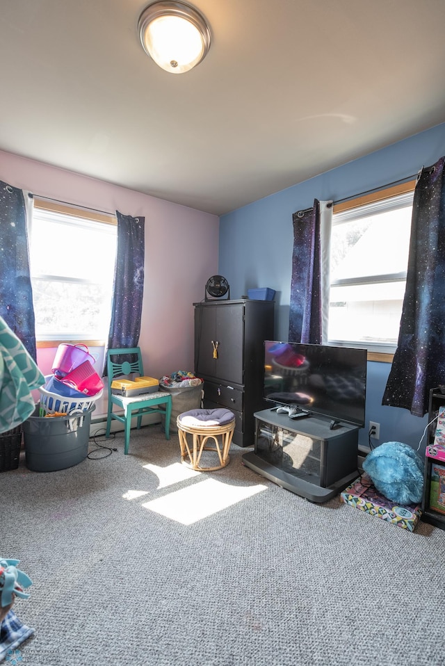 recreation room featuring carpet and a wealth of natural light