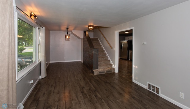 spare room featuring dark hardwood / wood-style floors