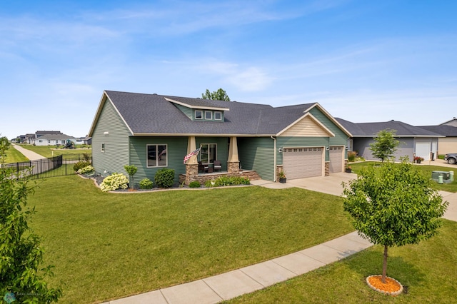 view of front of house featuring a front yard and a garage