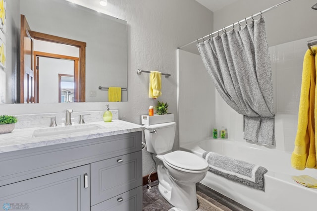 full bathroom with shower / bath combination with curtain, vanity, and toilet