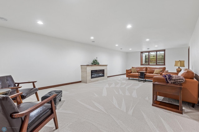 carpeted living room featuring a tiled fireplace