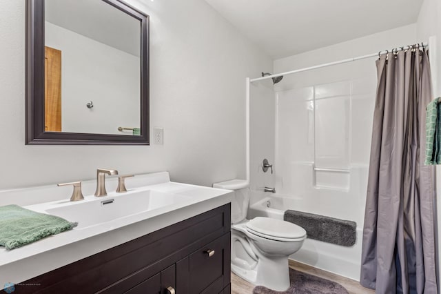 full bathroom with vanity, shower / bath combo with shower curtain, toilet, and wood-type flooring