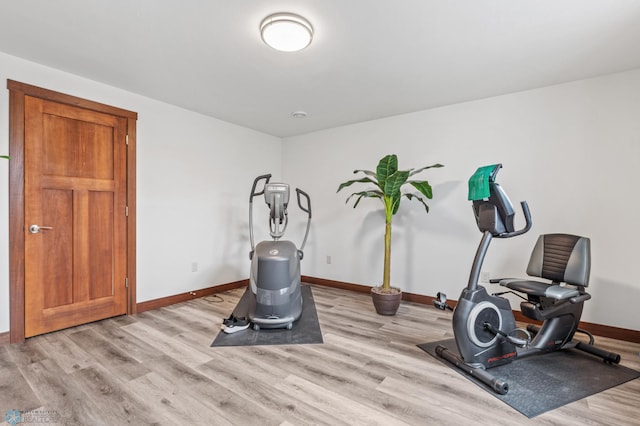 workout room featuring light hardwood / wood-style floors