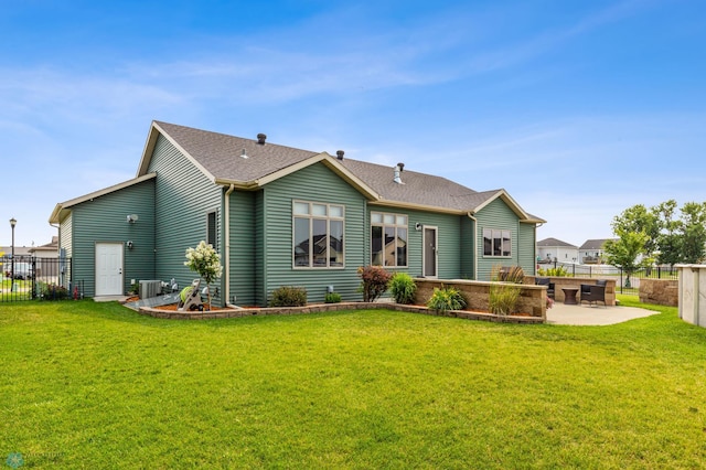 back of house with a patio area, cooling unit, and a lawn