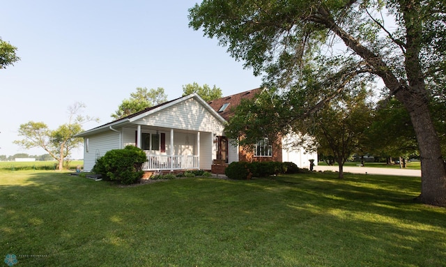 view of front of house with a porch and a front lawn